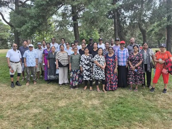 Large group posing in a park