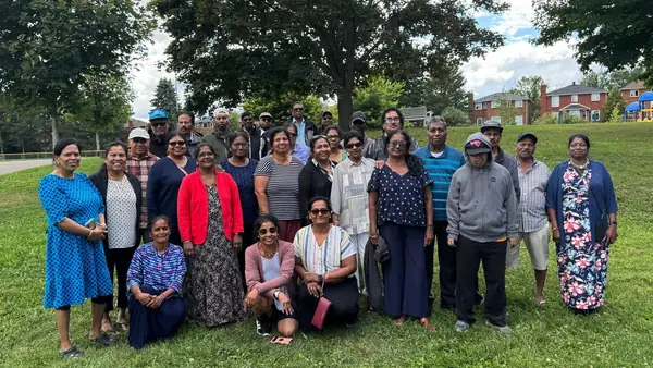 Large group posing on a lawn