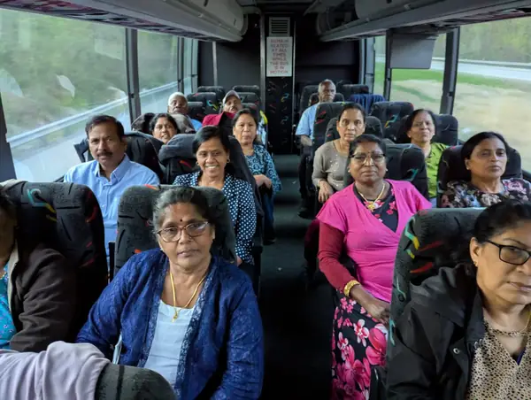 People seated on a tour bus