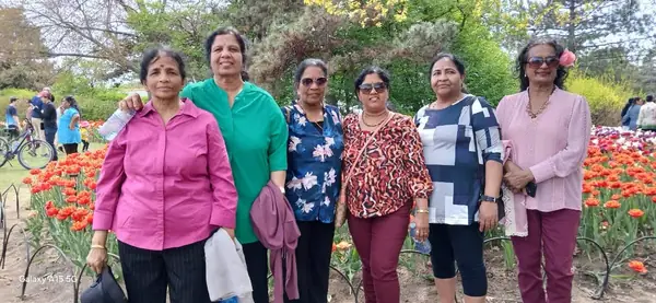 Group of women posing in a tulip garden