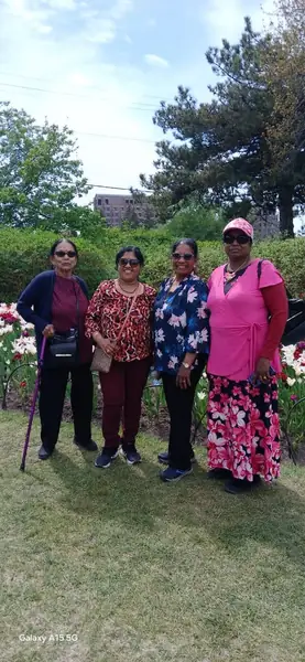 Small group posing on a lawn