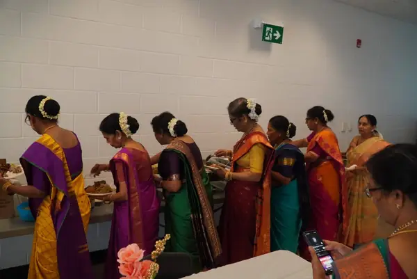 Women in saris performing together